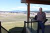 Chuck Myers enjoying the view and the sunshine from his rear deck.