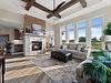 The Marbella features a 2-sided fireplace, an abundance of windows, and ceiling details in the Great Room.